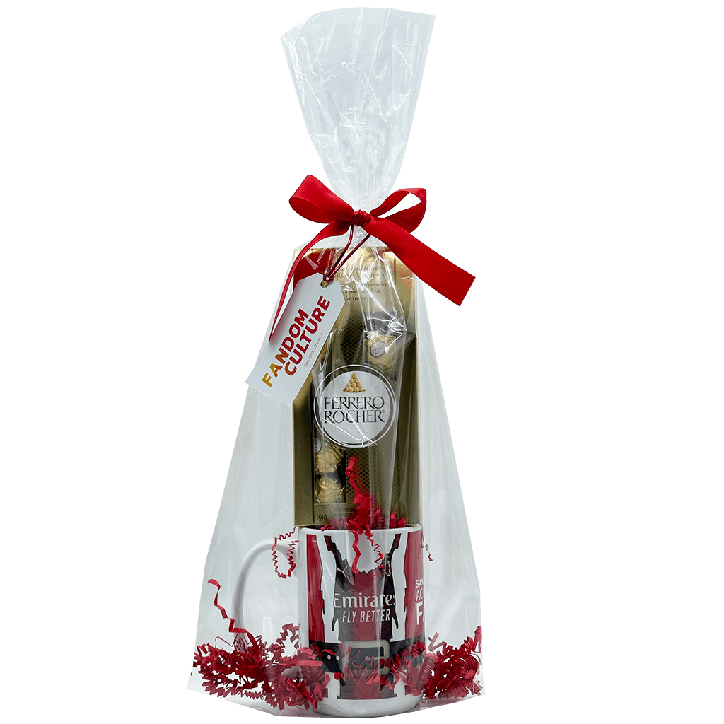 Introducing our Exclusive Santa Claus AC Milan Ceramic Mug Gift Set, a perfect blend of holiday magic and football passion. This premium ceramic mug features a full-wrapped graphic of Santa sporting his favorite Serie A team jersey, wrapped and ready for gifting, along with an 8-pack of Ferrero Rocher Hazelnut Milk Chocolates for sweet indulgence.